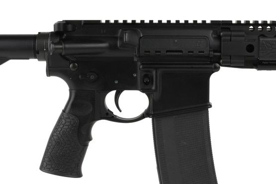 The Daniel Defense 5.56 AR-15 rifle features a staked castle nut